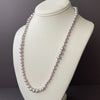 undulating waves of silver pearls and neon knots necklace