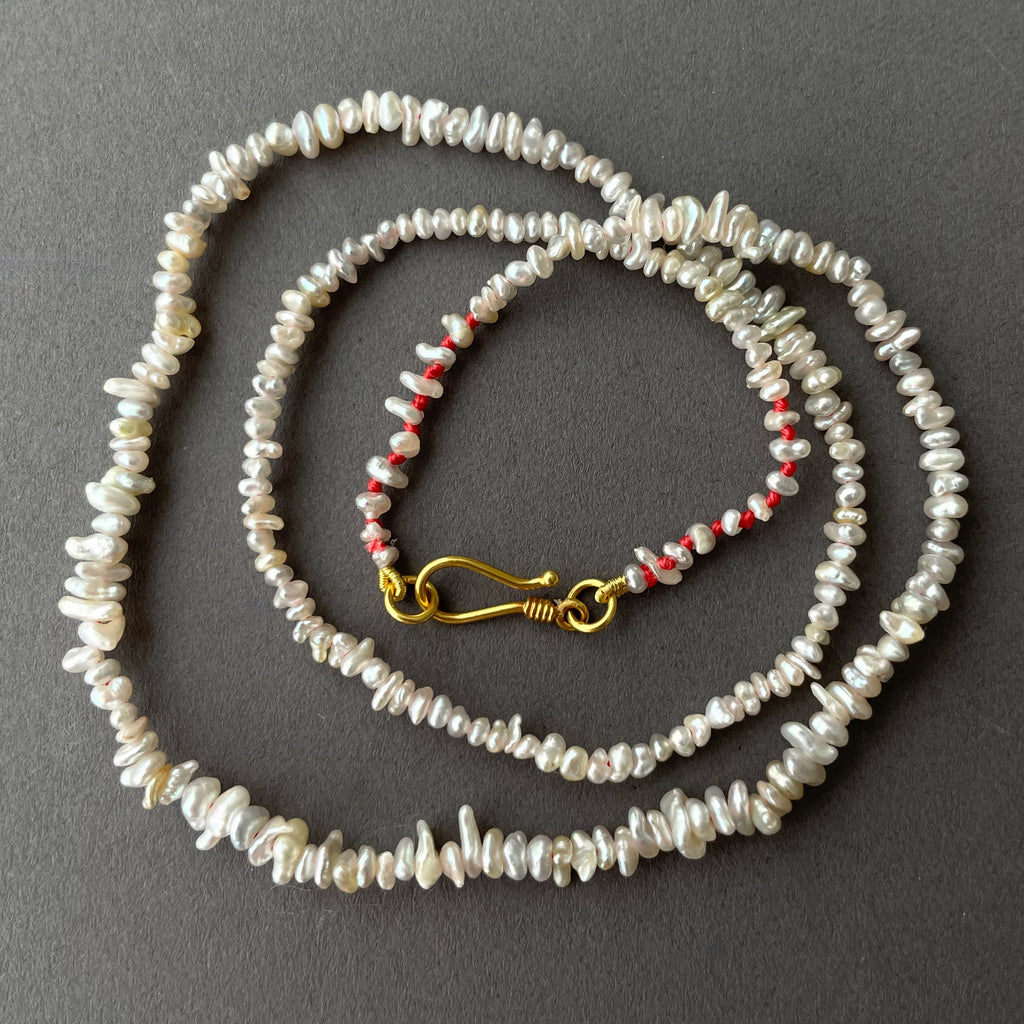 Japan Akoya keshi pearls with double 9 lucky red knots