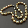 golden banded South Sea pearls on neon knots