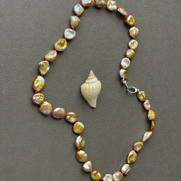 golden fresh water pearls on lucky red knots