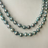 rope of 7mm circlé Tahitian pearls on blue knots