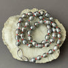 TINY SILVER TAHITIAN PEARLS ON RED KNOTS NECKLACE