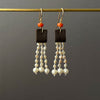 leather and coral pearl dangle earrings