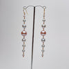 long cascade earrings made of silver and pink pearls in graduating sizes