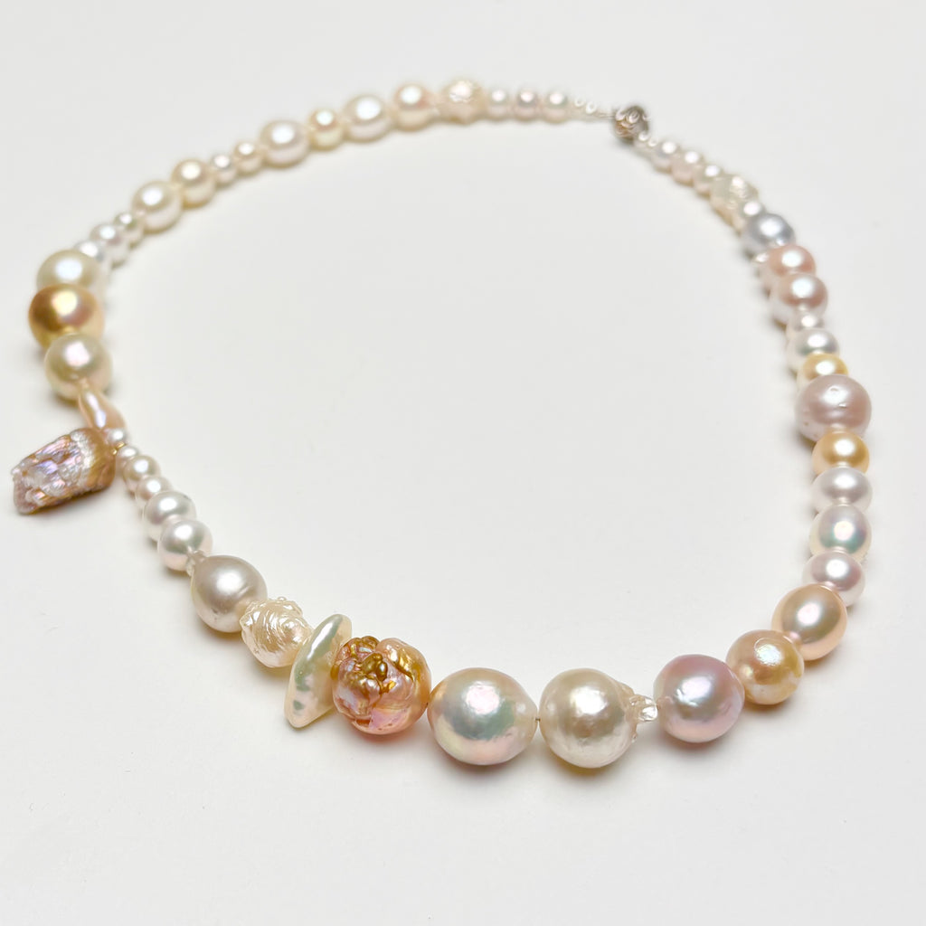 mixed pearl necklace on a white background