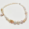 mixed pearl necklace on a white background