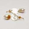 mother of pearl discs and fresh water pearls with golden areas by kojima pearl