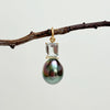 peacock color Tahitian pearl with topaz stone set in gold pendant charm by kojima pearl
