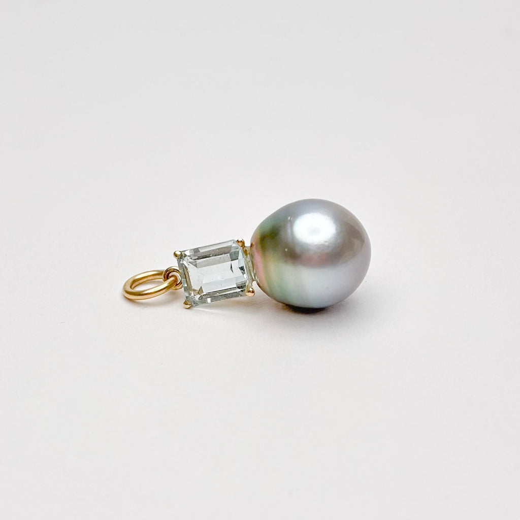 Pearl and emerald-cut topaz pendant on a white background by kojima pearl