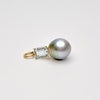 Pearl and emerald-cut topaz pendant on a white background by kojima pearl