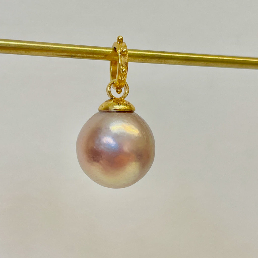 champagne pink near round pearl pendant