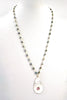 as the waves wash over necklace