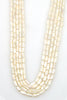5 strand lot of long-drilled banded pearls