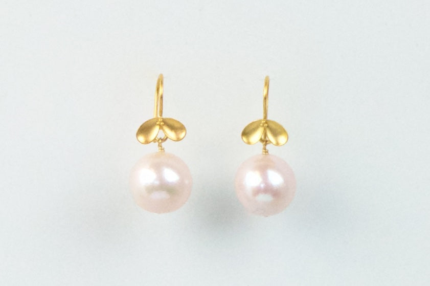 golden floral and pink pearl earrings